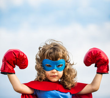 Child with superhero cape
